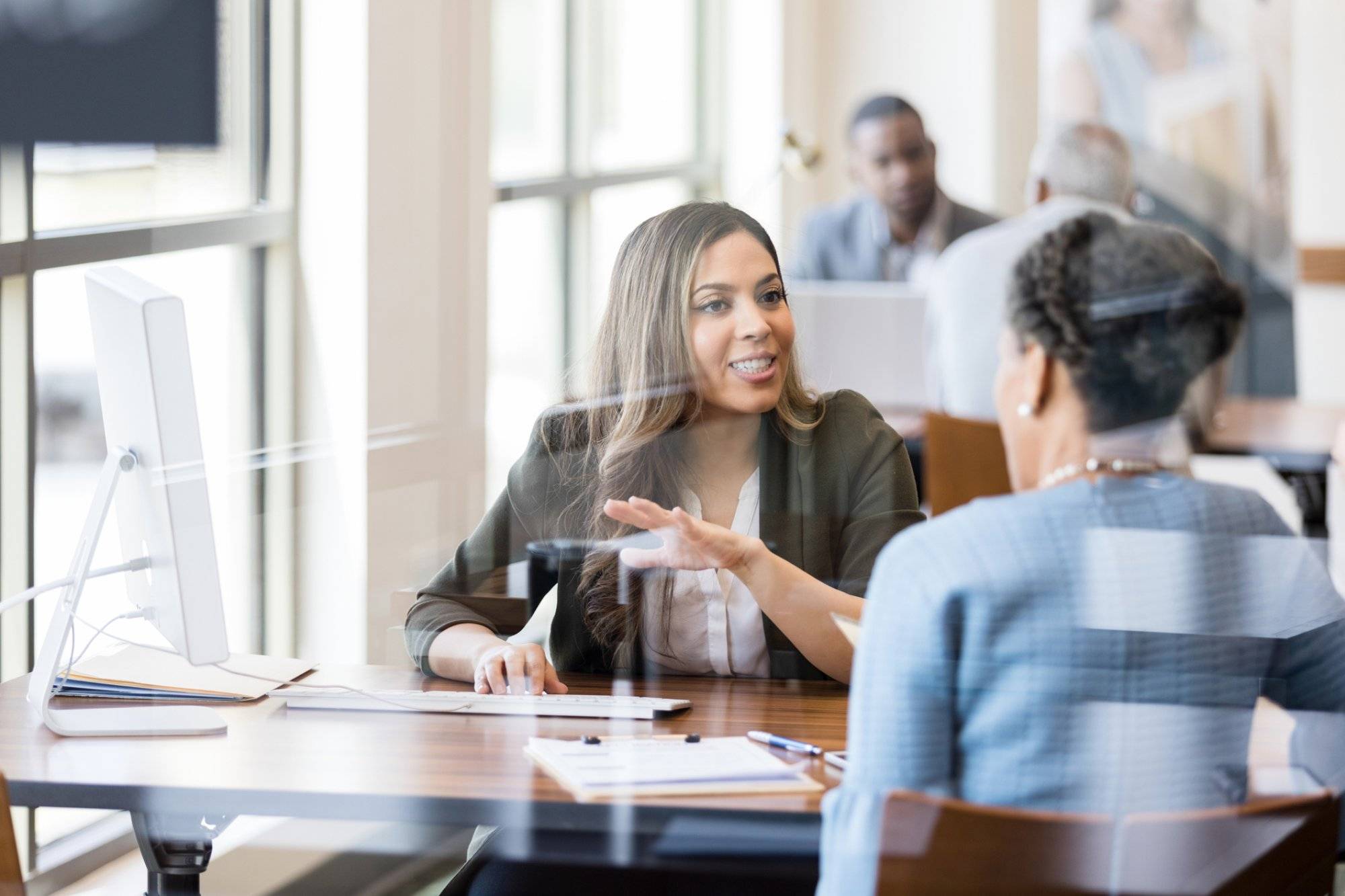 Banker discusses banking services to new customer