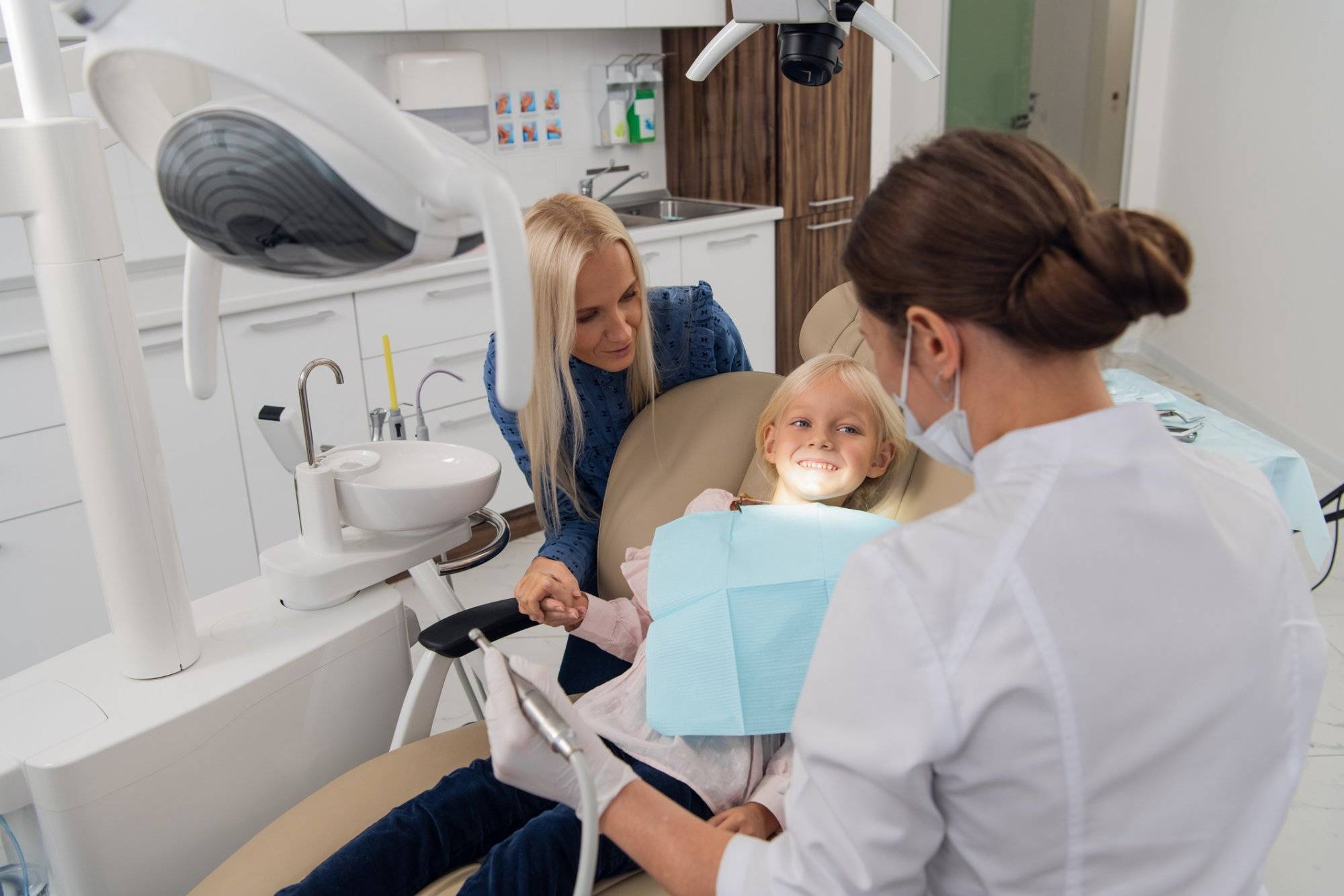 Mom and her little daughter visiting a pediatric dental specialist